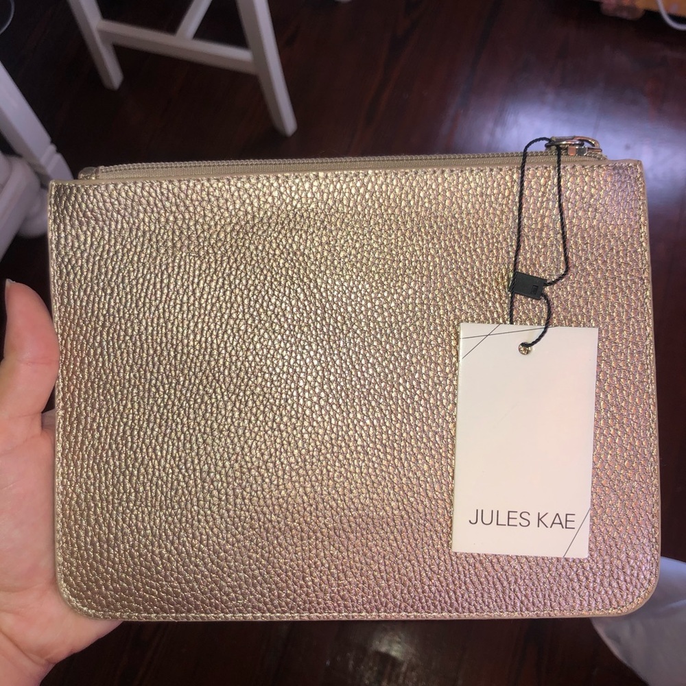 Brand new Juleskae rose gold wristlet